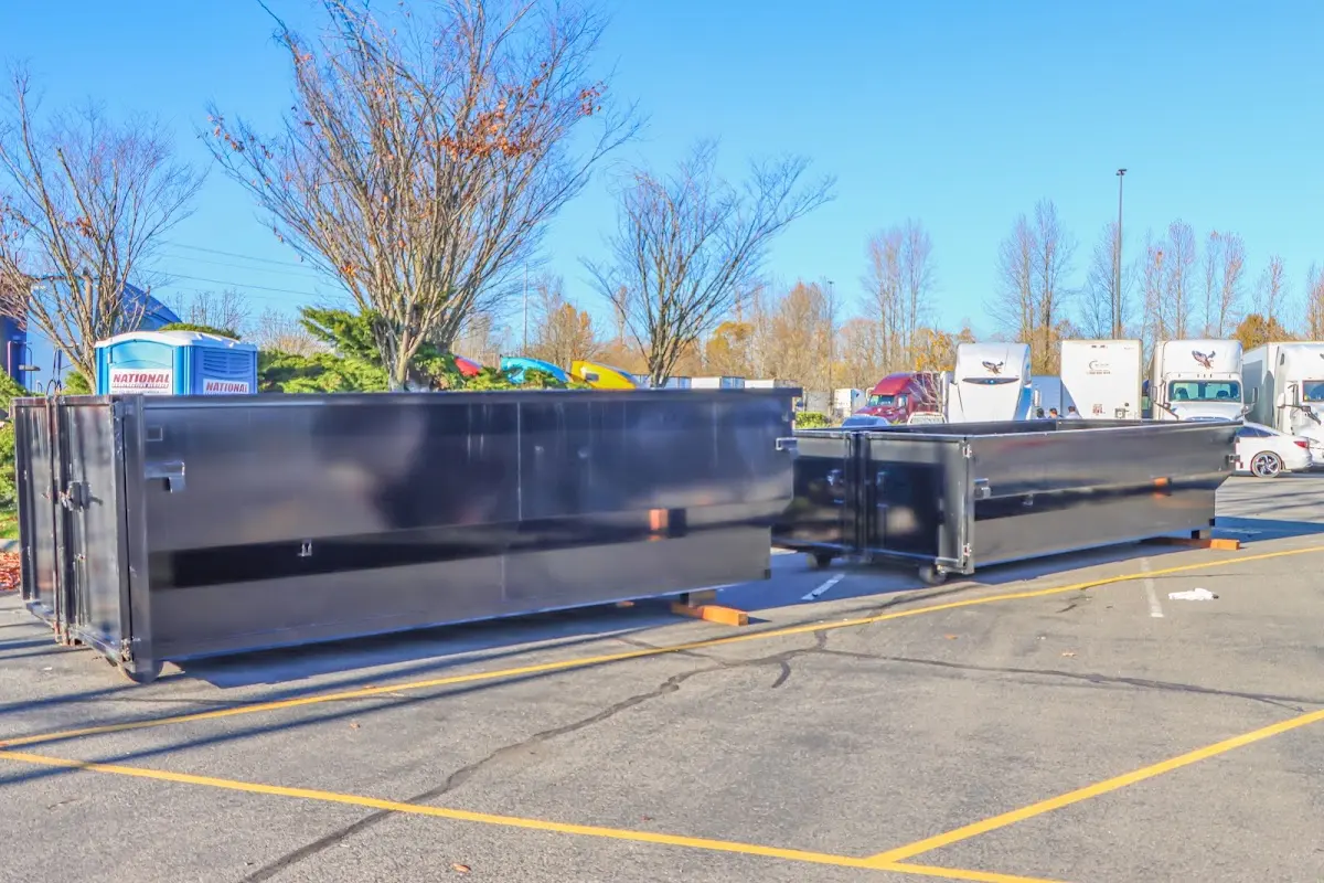 Professional dumpster rental service with roll-off container on residential driveway in Anadarko